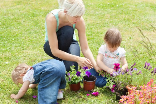 Gardening team reviewing outdoor work conditions for safety